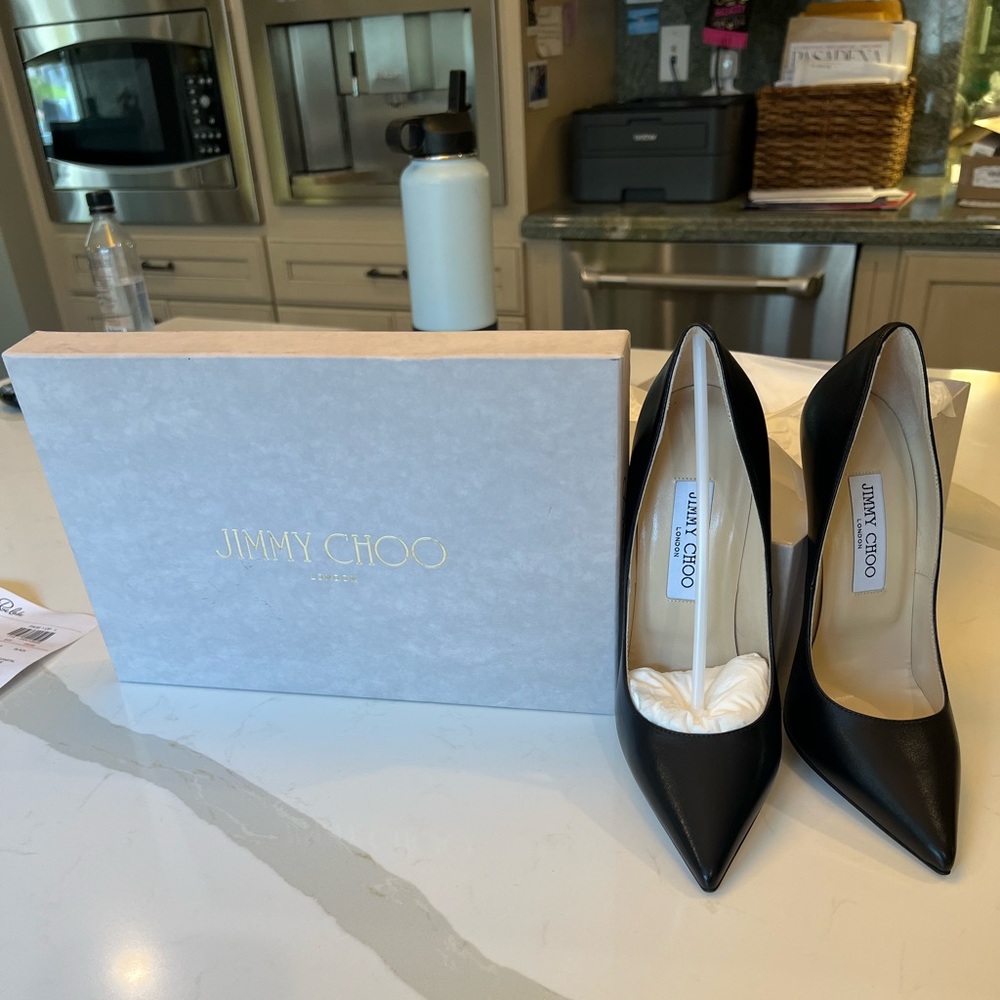 Jimmy Choo - high heel . Never worn , color “ kid Black “. 5 1/2 inch heel.